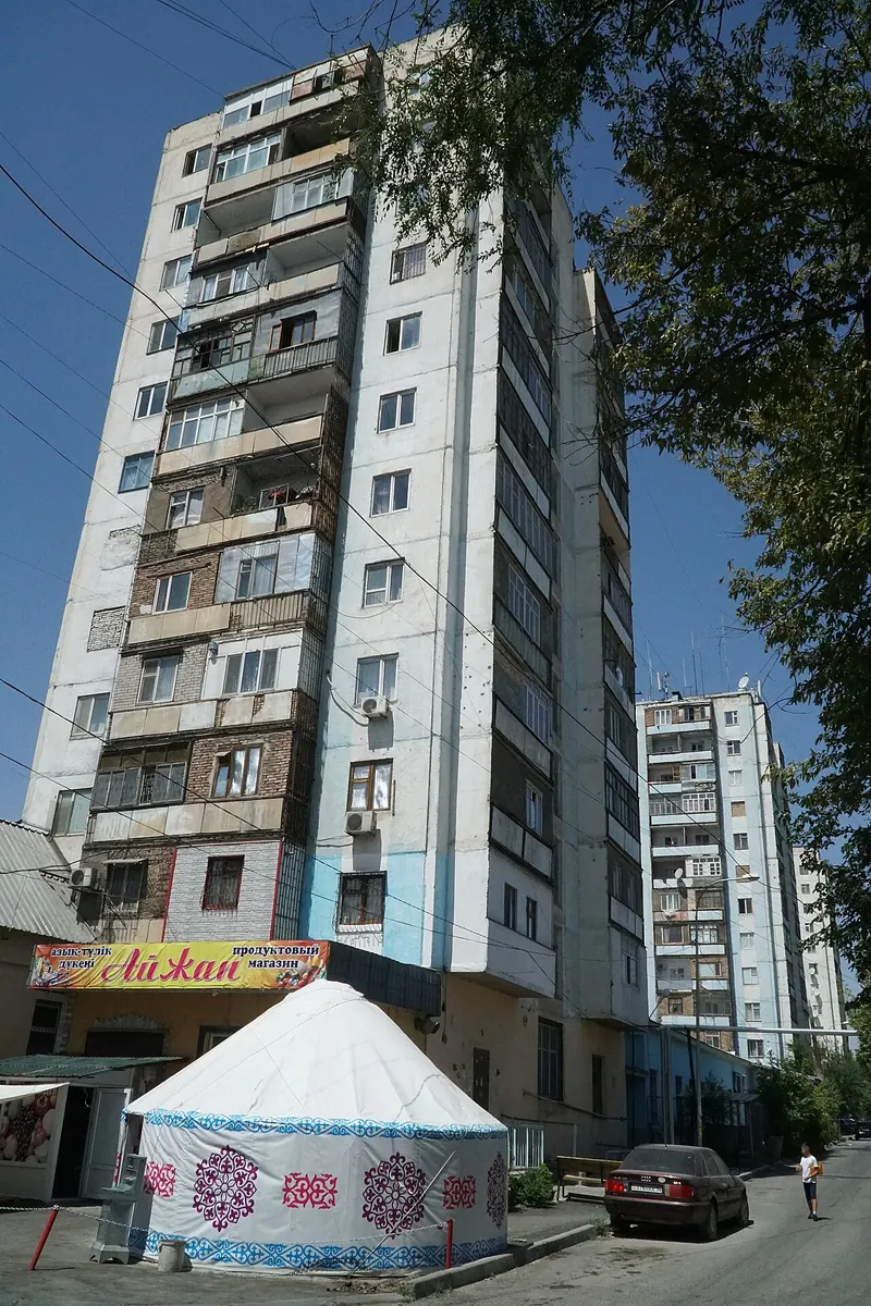 A ger beside a panel apartment block